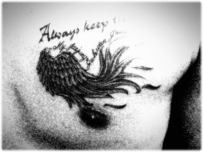 Right below his old “2009″ tattoo with the words, “Always keep the faith,” 